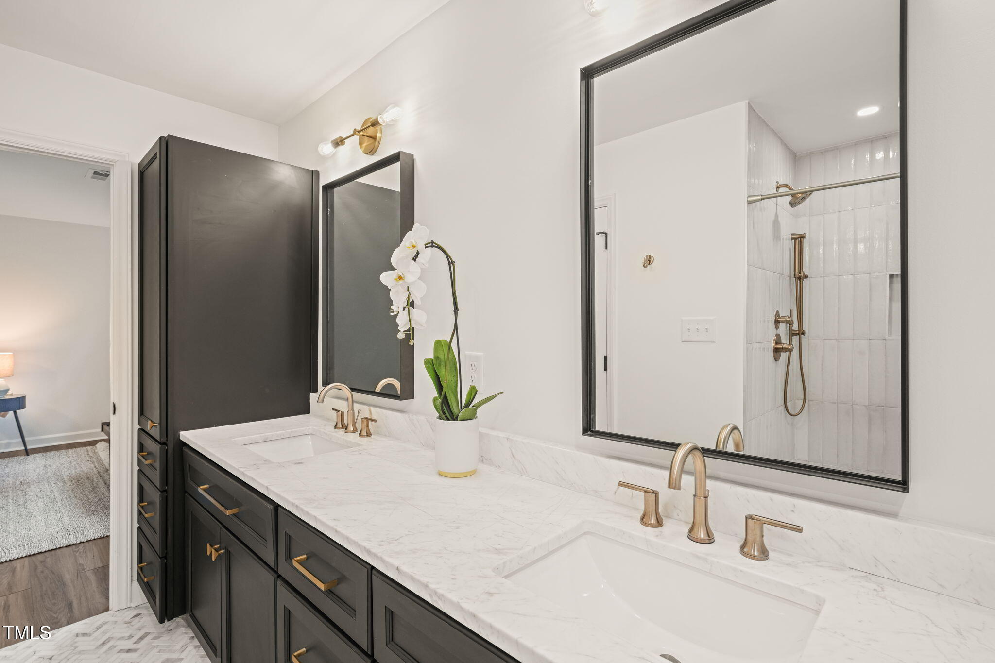 4714 Highgate Drive Durham, NC 27713 - Photo 28 of 50 a bathroom with double vanity sink and a mirror