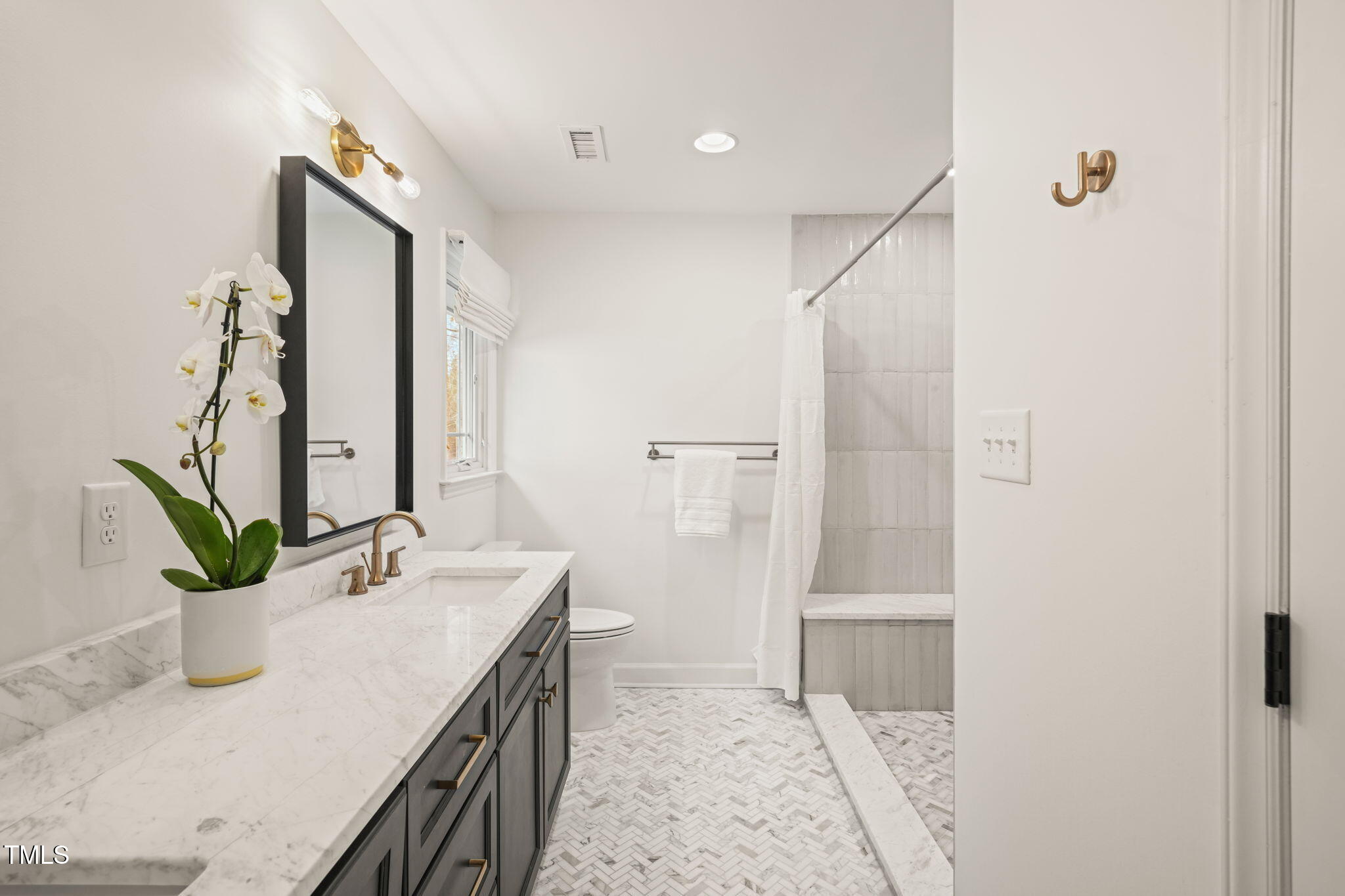 4714 Highgate Drive Durham, NC 27713 - Photo 29 of 50 a bathroom with a granite countertop sink a mirror and shower
