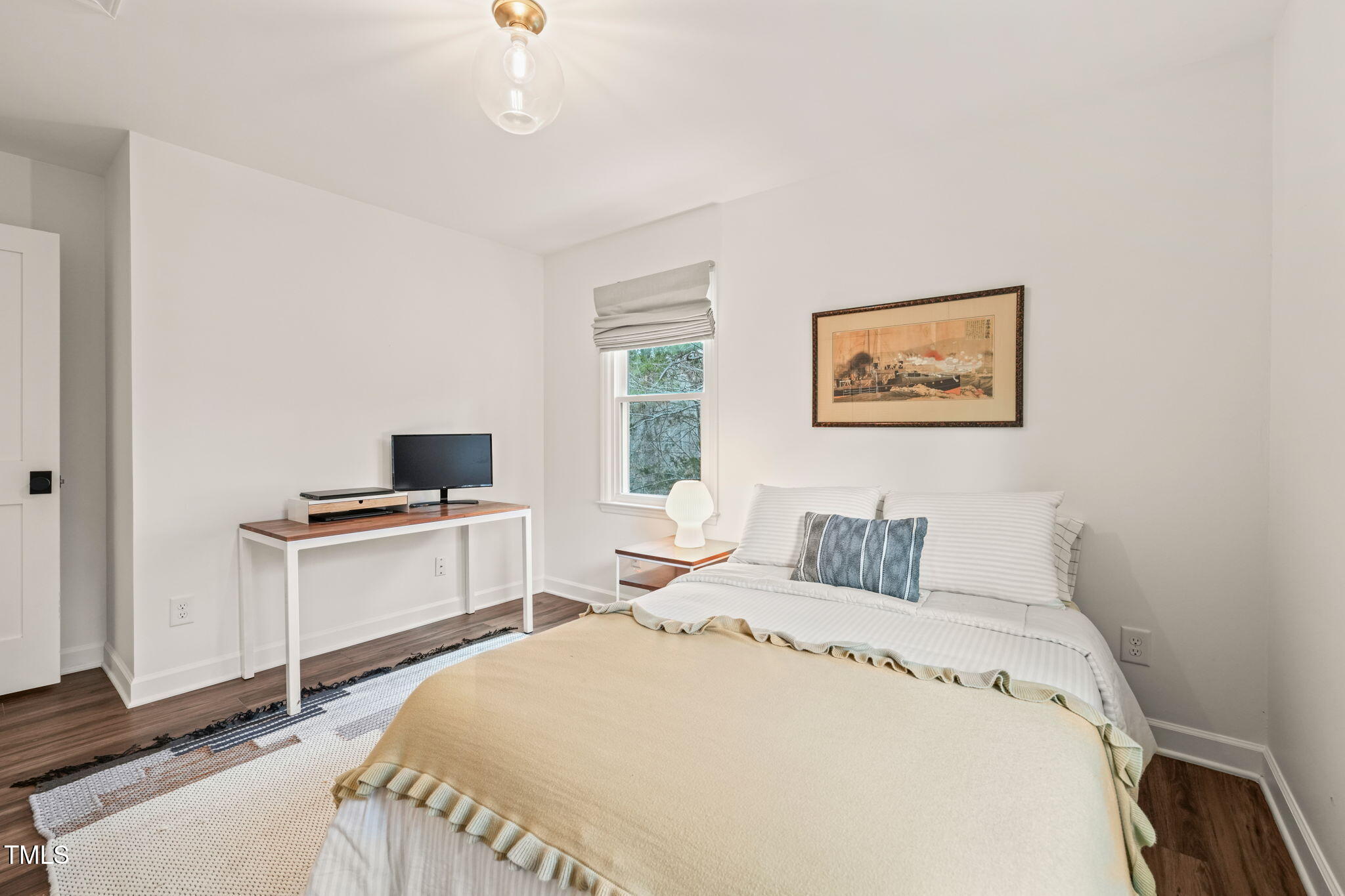 4714 Highgate Drive Durham, NC 27713 - Photo 37 of 50 a bedroom with a bed and a chandelier