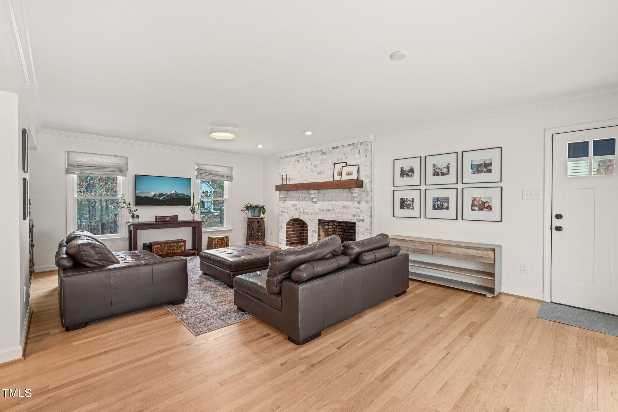 4714 Highgate Drive Durham, NC 27713 - Photo 4 of 50 a living room with furniture and a fireplace