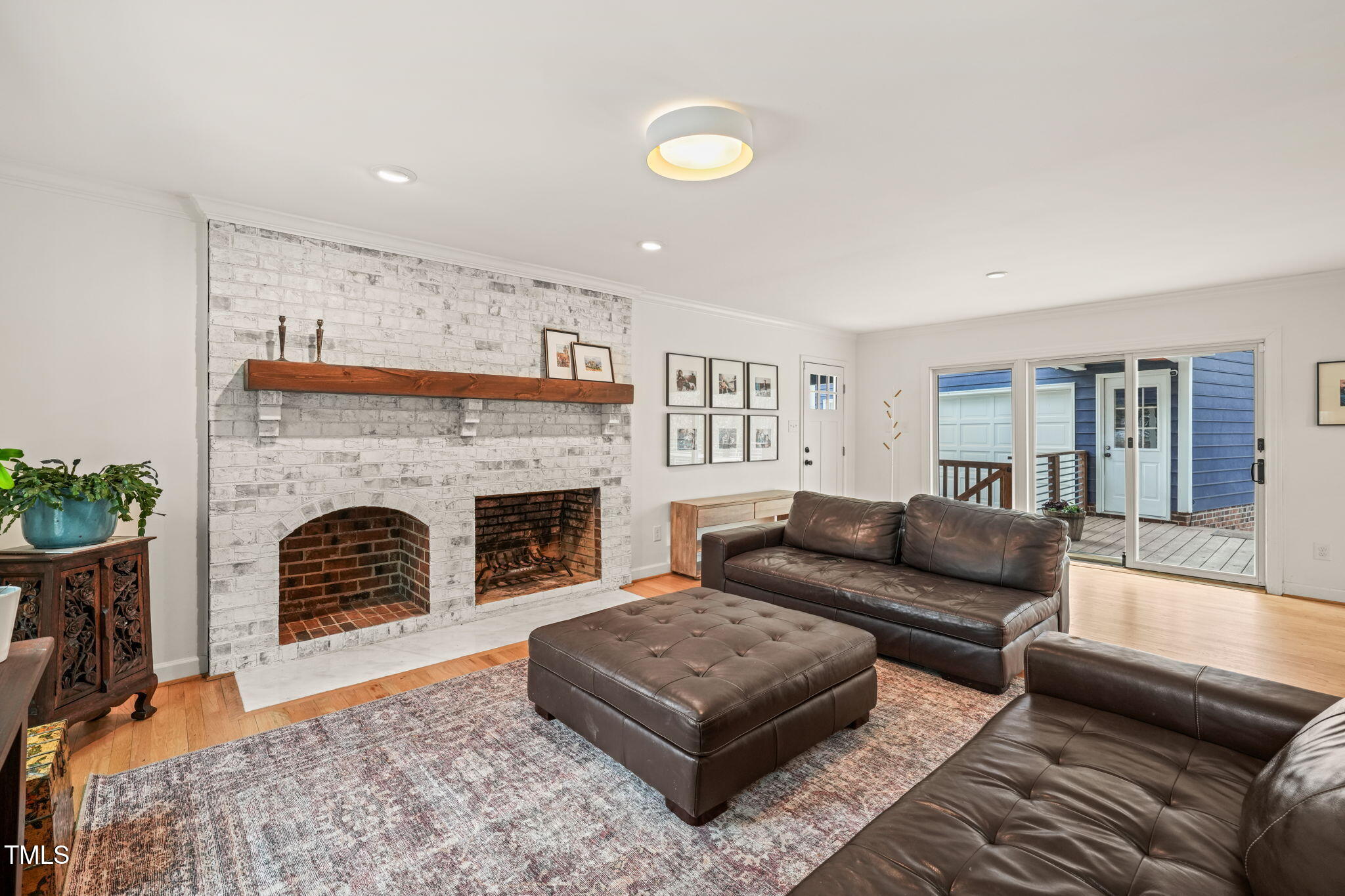 4714 Highgate Drive Durham, NC 27713 - Photo 5 of 50 a living room with furniture and a fireplace