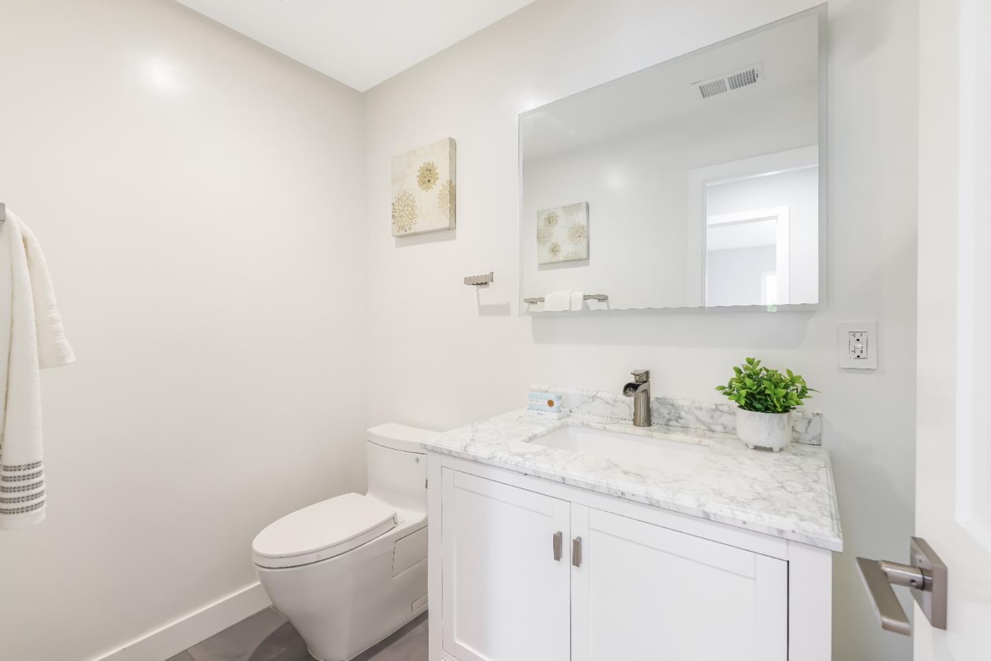 1120 Springfield Drive Campbell, CA 95008 - Photo 21 of 48 a bathroom with a granite countertop sink a toilet and a mirror