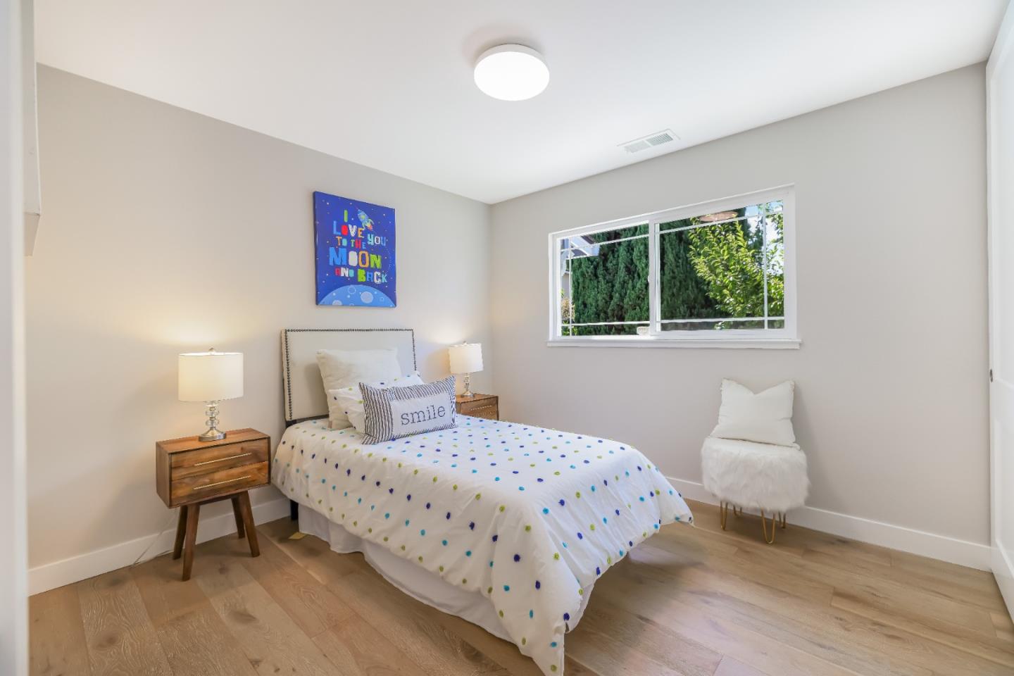 1120 Springfield Drive Campbell, CA 95008 - Photo 26 of 48 a bedroom with a bed and a lamp on table
