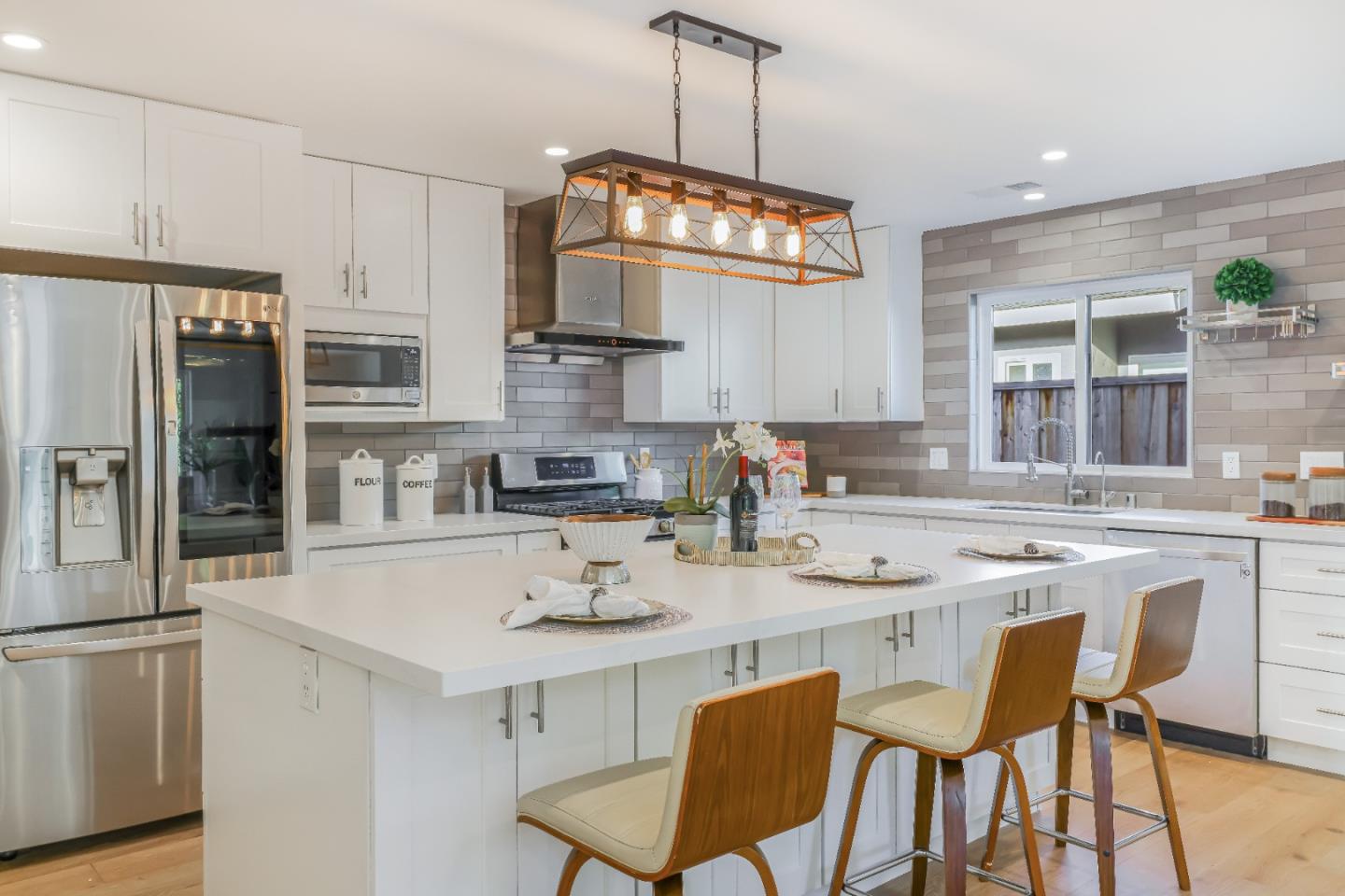 1120 Springfield Drive Campbell, CA 95008 - Photo 8 of 48 a kitchen with stainless steel appliances a dining table chairs stove and refrigerator