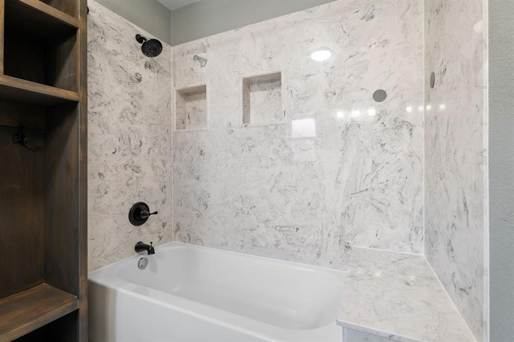 373 Ingred Street Waco, TX 76705 - Photo 16 of 39 a bathroom with a bathtub and shower