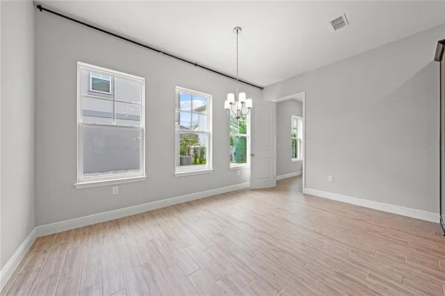 a kitchen with stainless steel appliances granite countertop a sink a stove and refrigerator