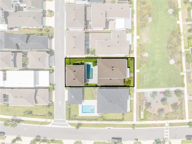 an aerial view of residential building with outdoor space and lake view