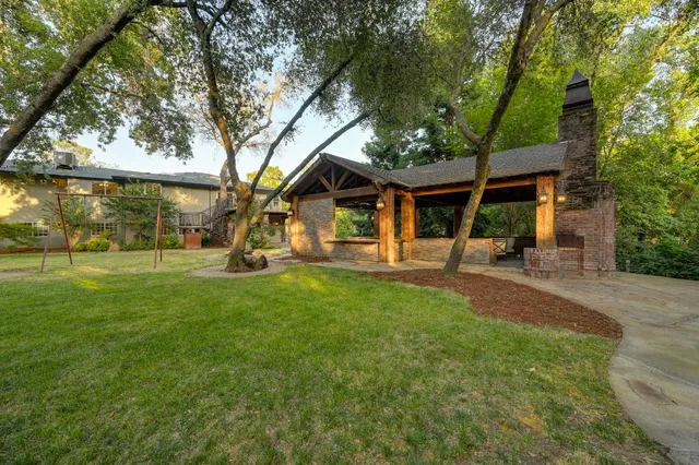 a spacious bathroom with a double vanity sink a mirror and shower