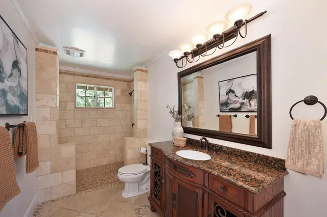 a view of a swimming pool with a patio and a yard