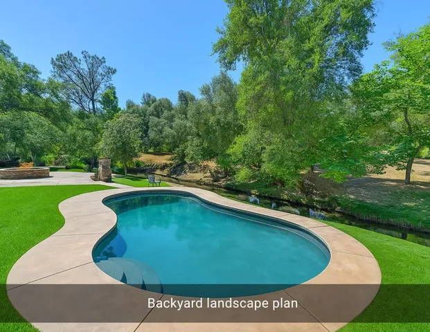 a view of a house with backyard and a tree