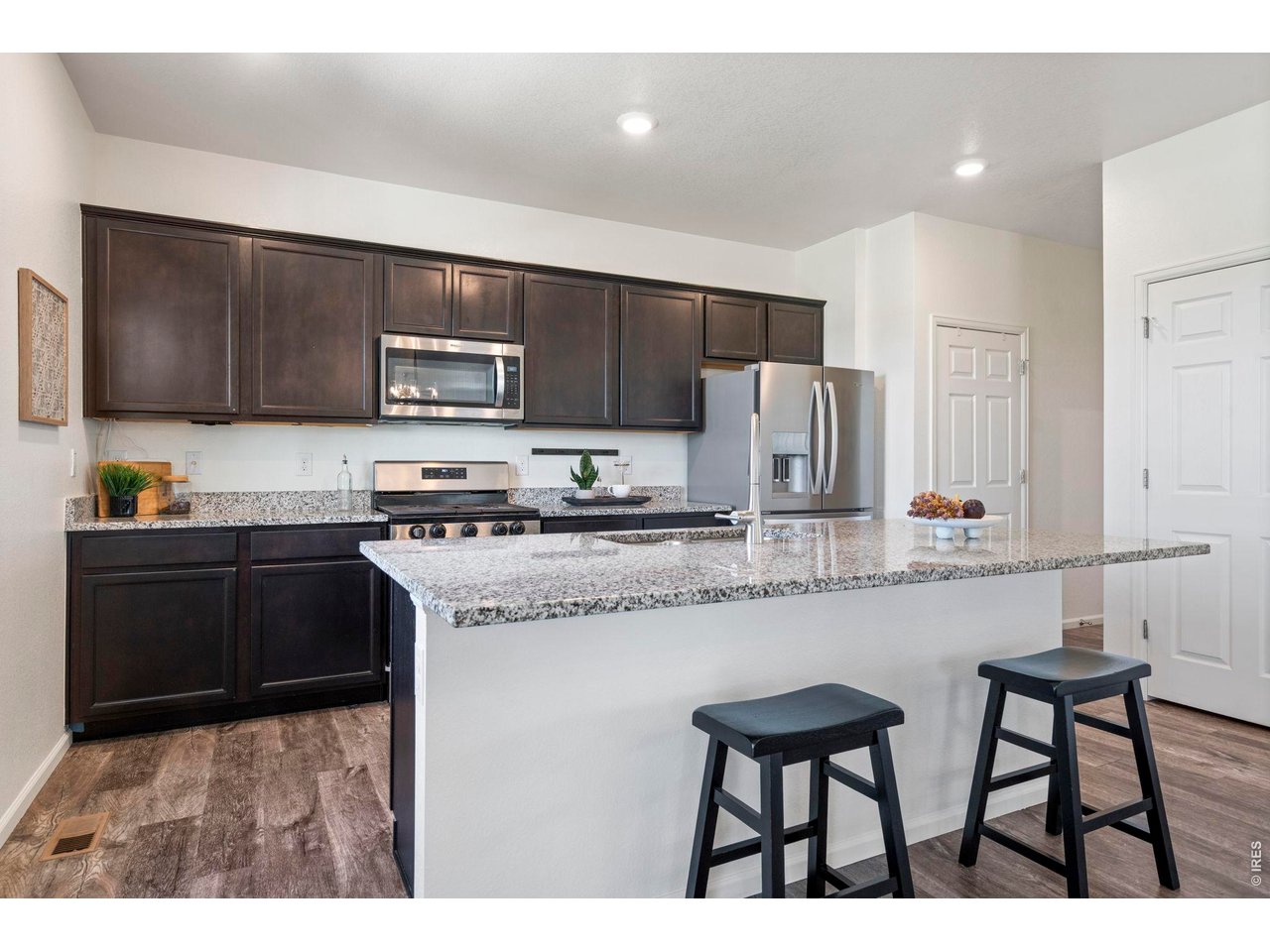 10080 Cedar Street Firestone, CO 80504 - Photo 13 of 38 Island features granite counter tops