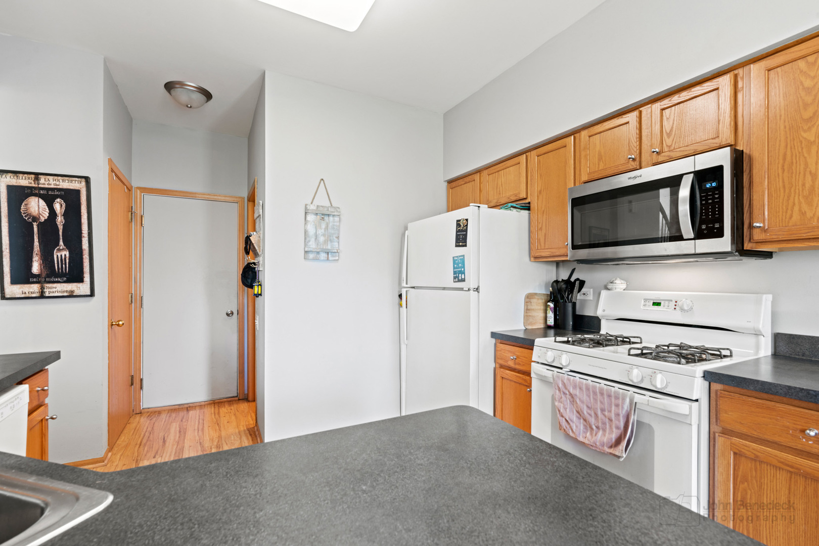 1106 Delta Drive Elgin, IL 60123 - Photo 11 of 26 a kitchen with stainless steel appliances a refrigerator stove and microwave