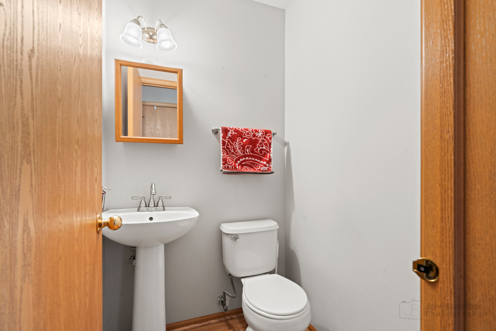 1106 Delta Drive Elgin, IL 60123 - Photo 12 of 26 a bathroom with a toilet sink and mirror