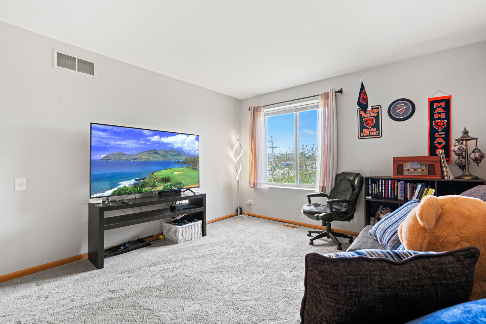 1106 Delta Drive Elgin, IL 60123 - Photo 21 of 26 a living room with furniture and a flat screen tv
