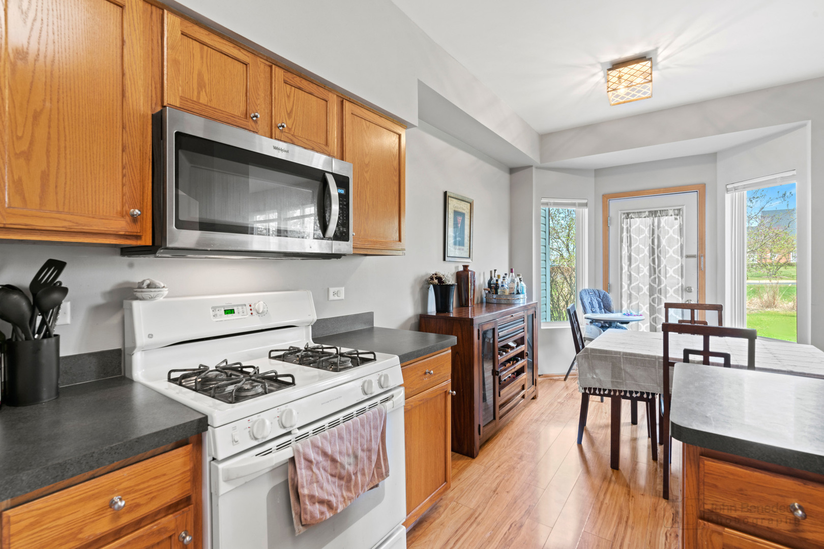 1106 Delta Drive Elgin, IL 60123 - Photo 8 of 26 a kitchen with a stove a sink and a microwave