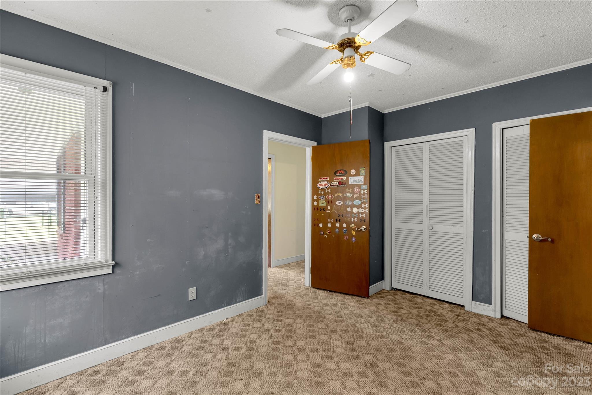1323 Westwood Road Lancaster, SC 29720 - Photo 11 of 25 an empty room with closet and a chandelier fan