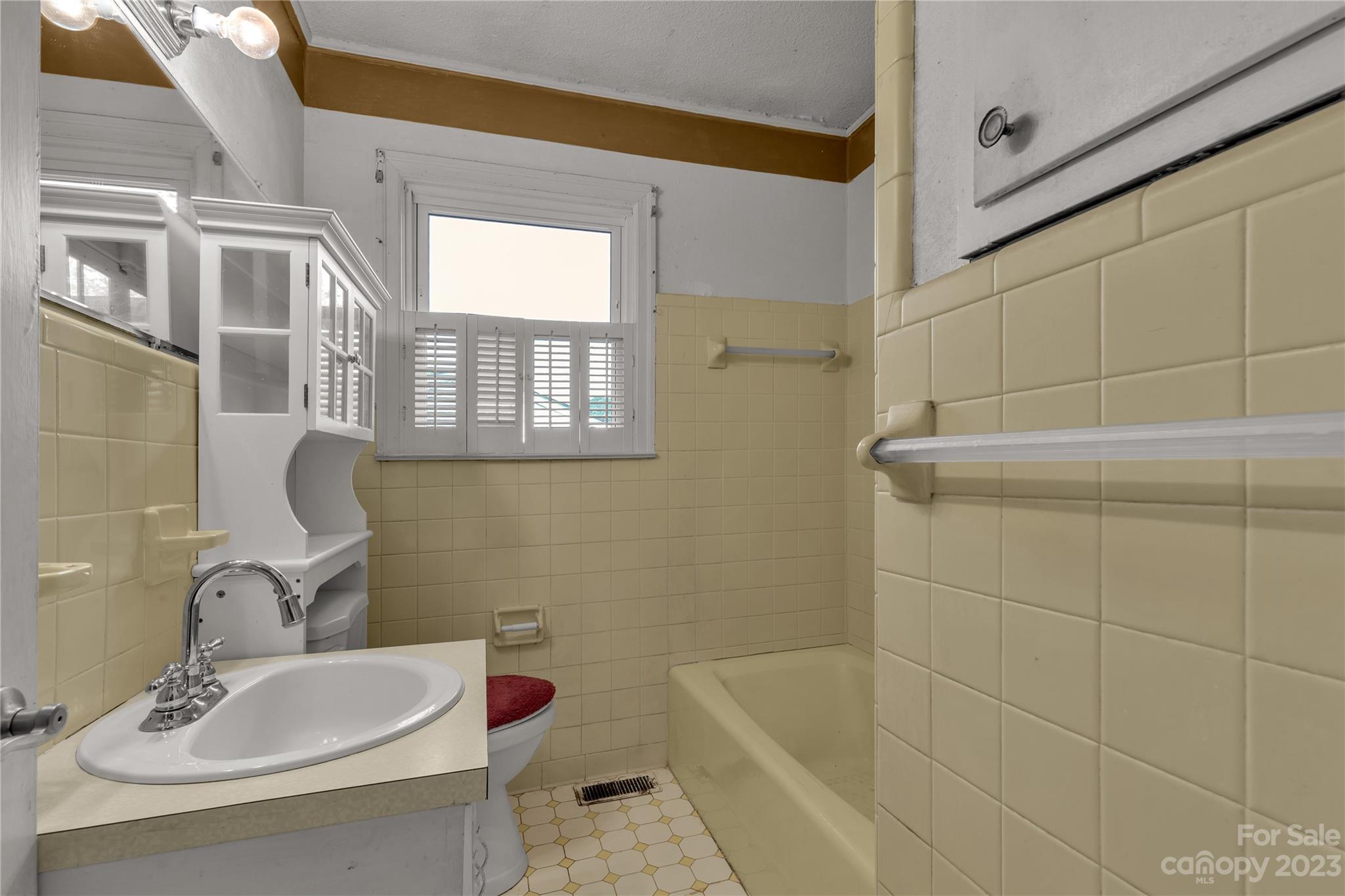1323 Westwood Road Lancaster, SC 29720 - Photo 14 of 25 a bathroom with a sink a toilet and shower