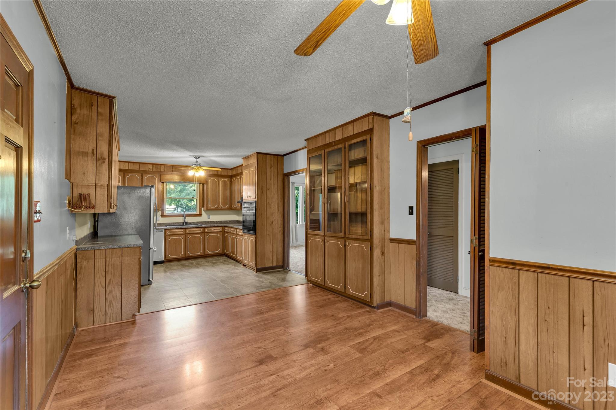 1323 Westwood Road Lancaster, SC 29720 - Photo 6 of 25 a view of a kitchen with refrigerator and wooden floor