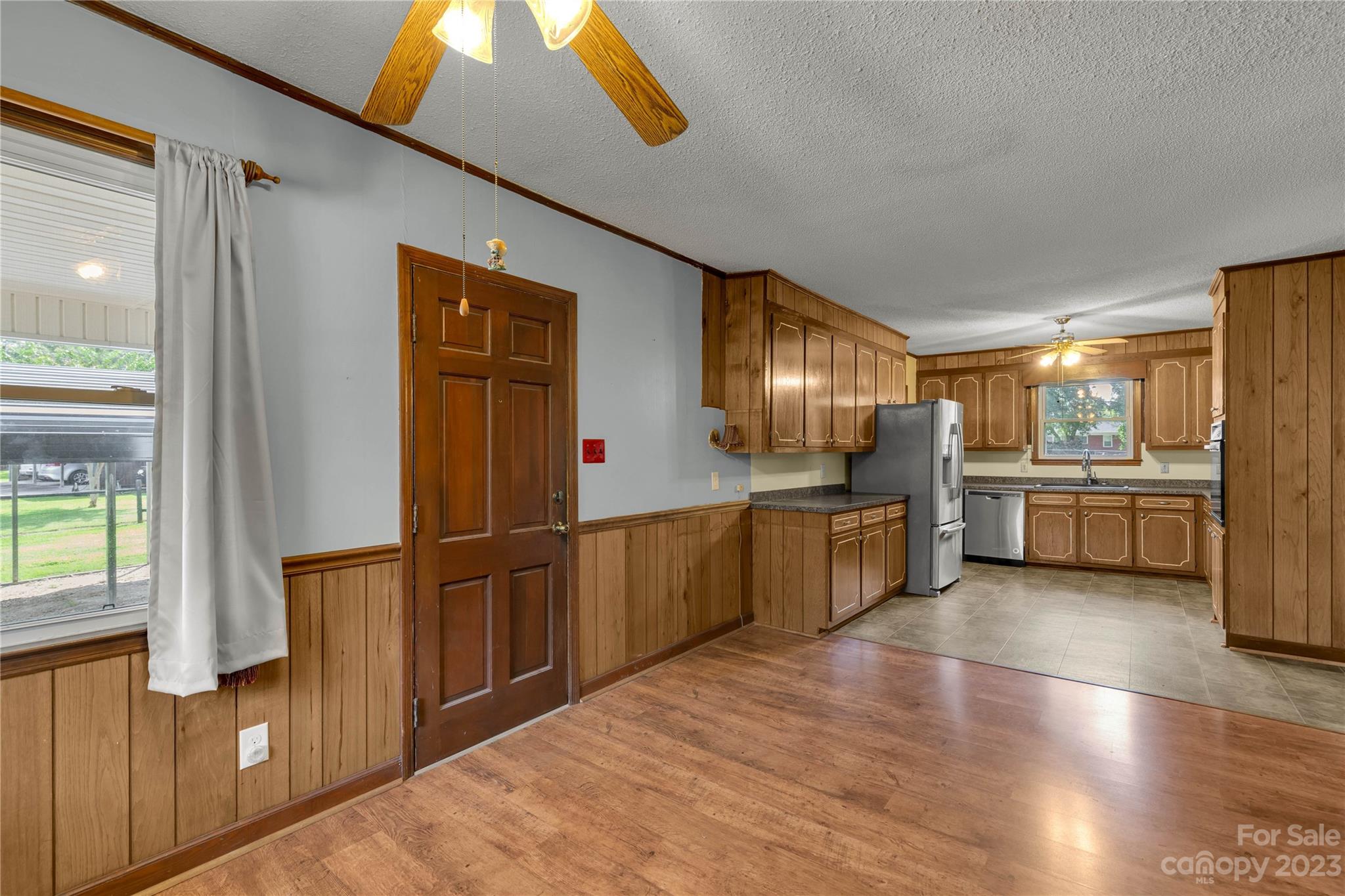 1323 Westwood Road Lancaster, SC 29720 - Photo 7 of 25 a kitchen with stainless steel appliances kitchen island granite countertop a refrigerator and a stove top oven
