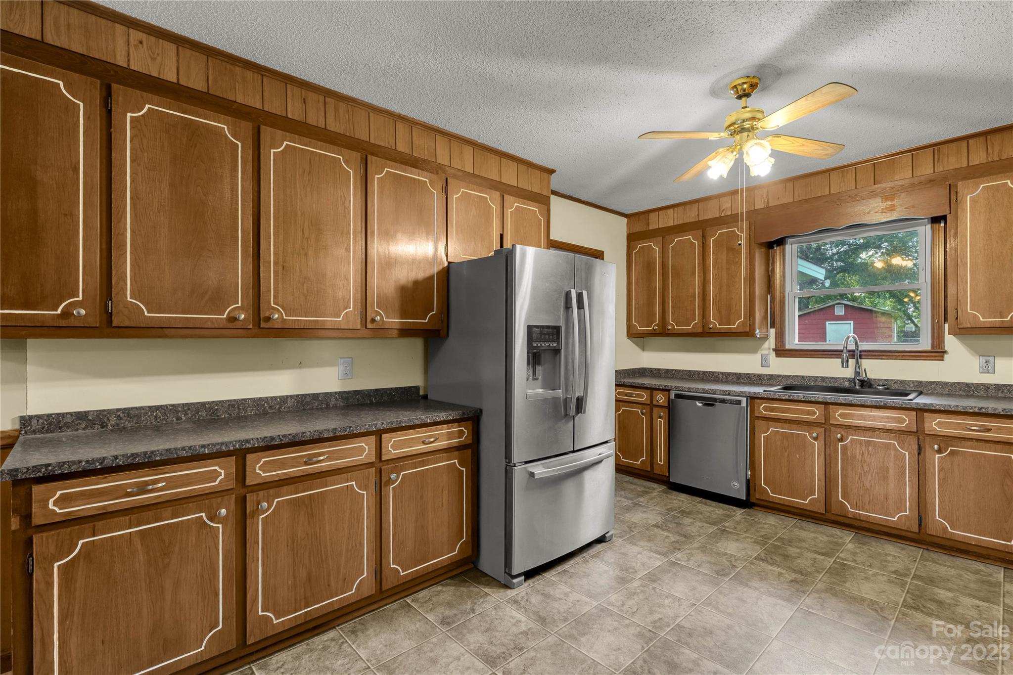 1323 Westwood Road Lancaster, SC 29720 - Photo 8 of 25 a kitchen with stainless steel appliances granite countertop a refrigerator sink and stove