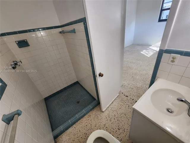 a bathroom with a sink and mirror