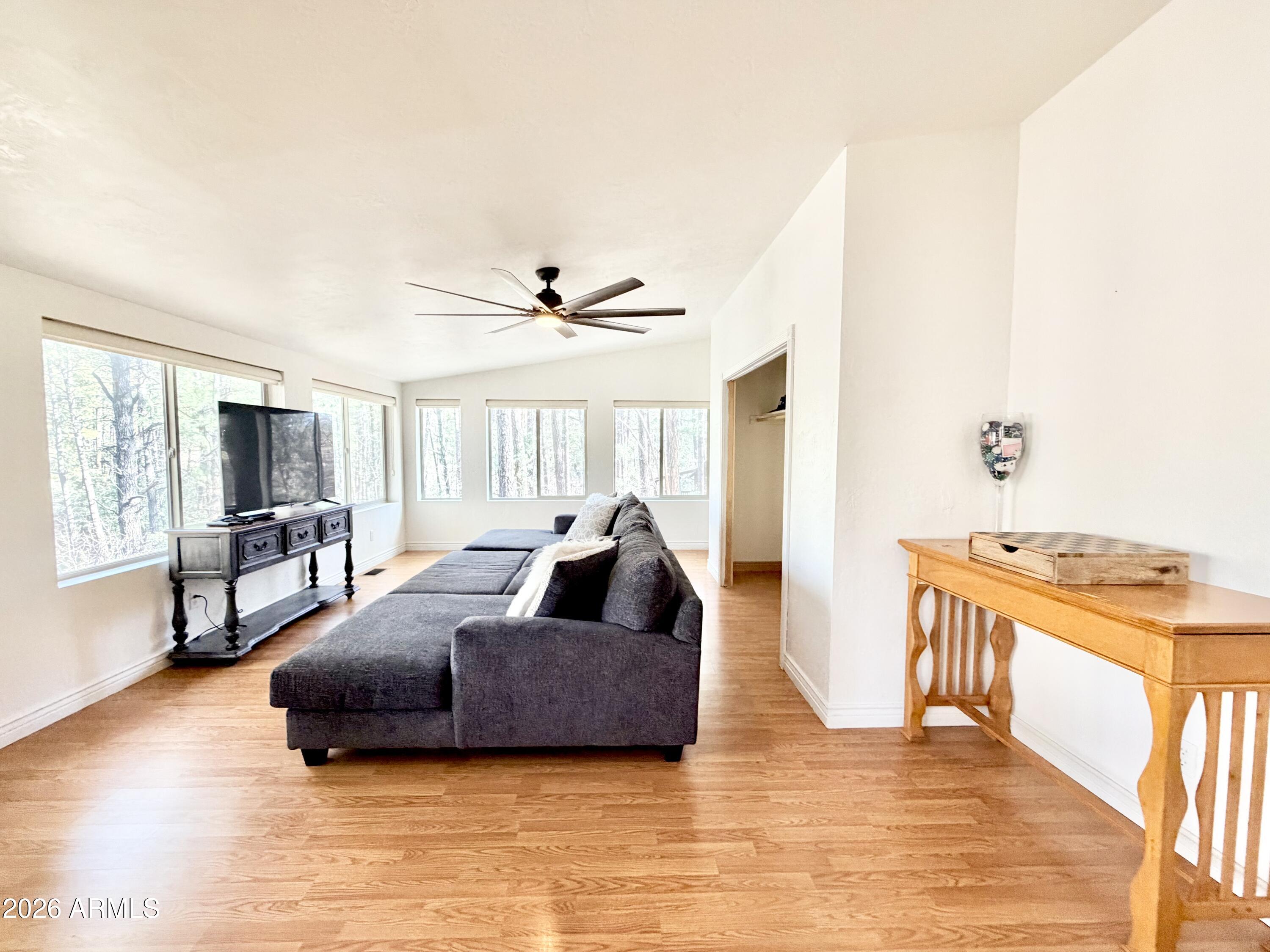 6870 Robbin Lane Pine, AZ 85544 - Photo 13 of 37 a living room with furniture and a large window