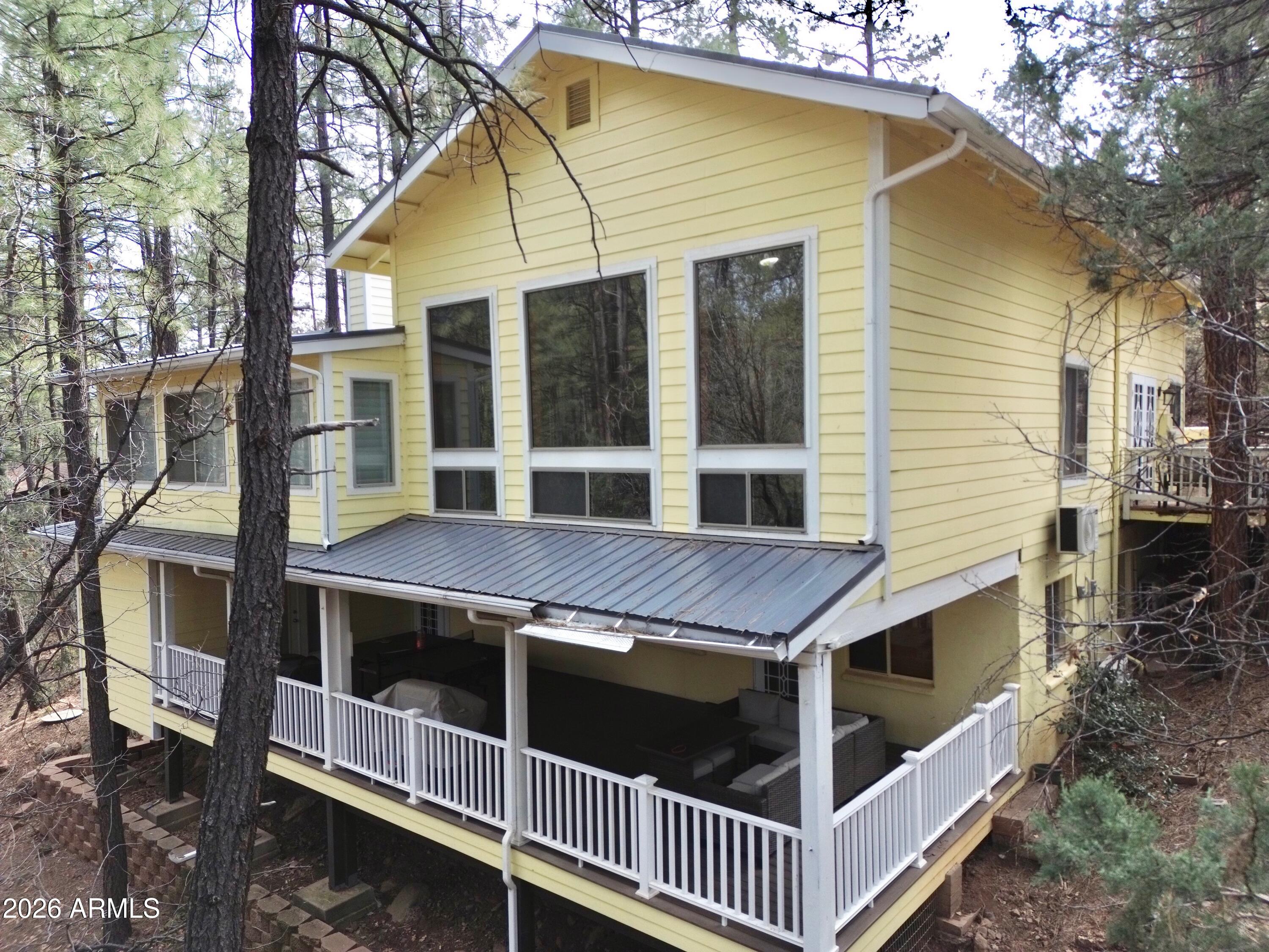 6870 Robbin Lane Pine, AZ 85544 - Photo 29 of 38 a view of a house with a yard