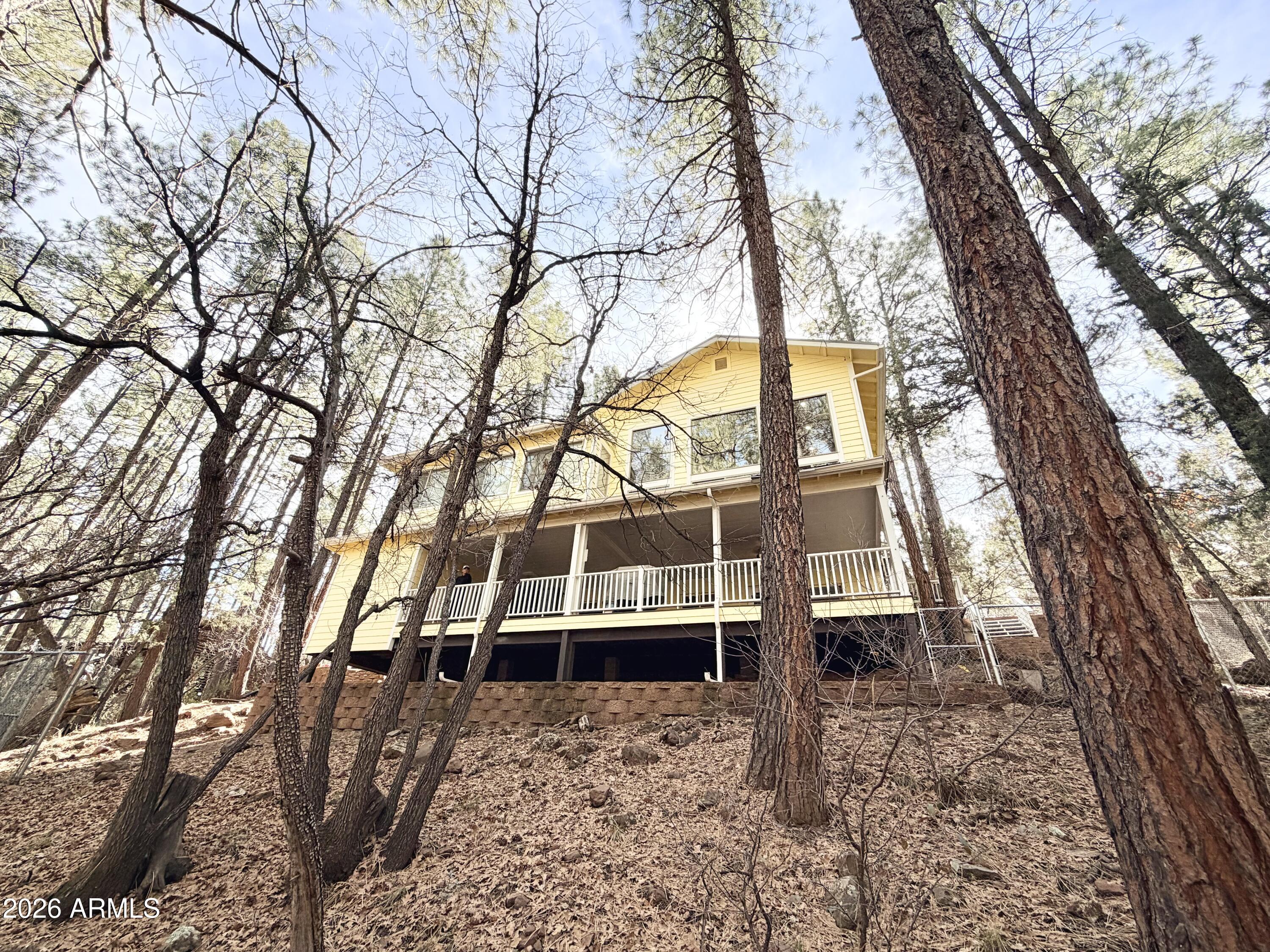 6870 Robbin Lane Pine, AZ 85544 - Photo 29 of 37 a view of a house with a yard