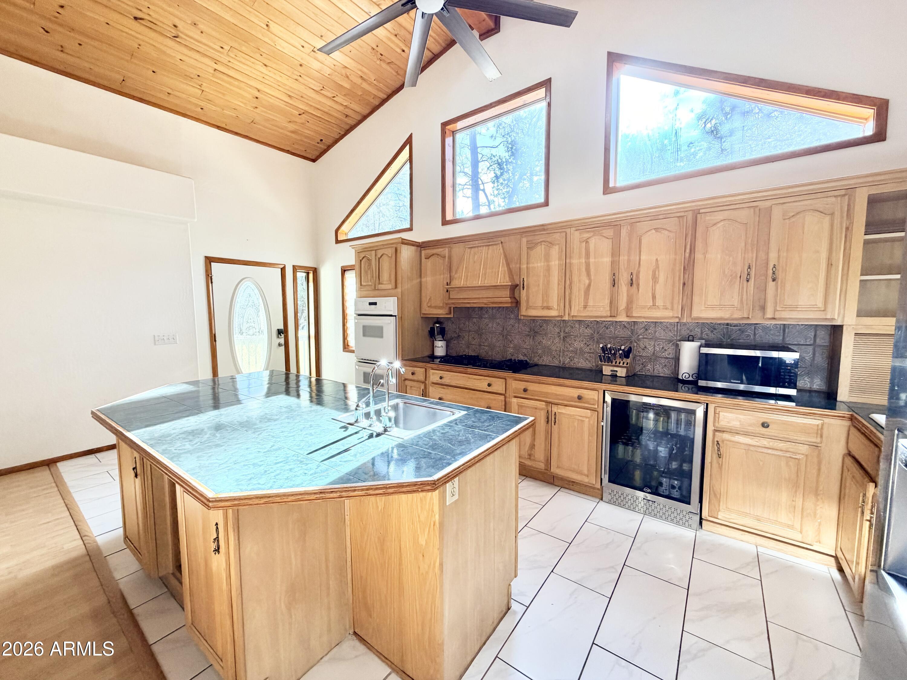 6870 Robbin Lane Pine, AZ 85544 - Photo 3 of 37 a kitchen with stainless steel appliances granite countertop a sink stove and refrigerator