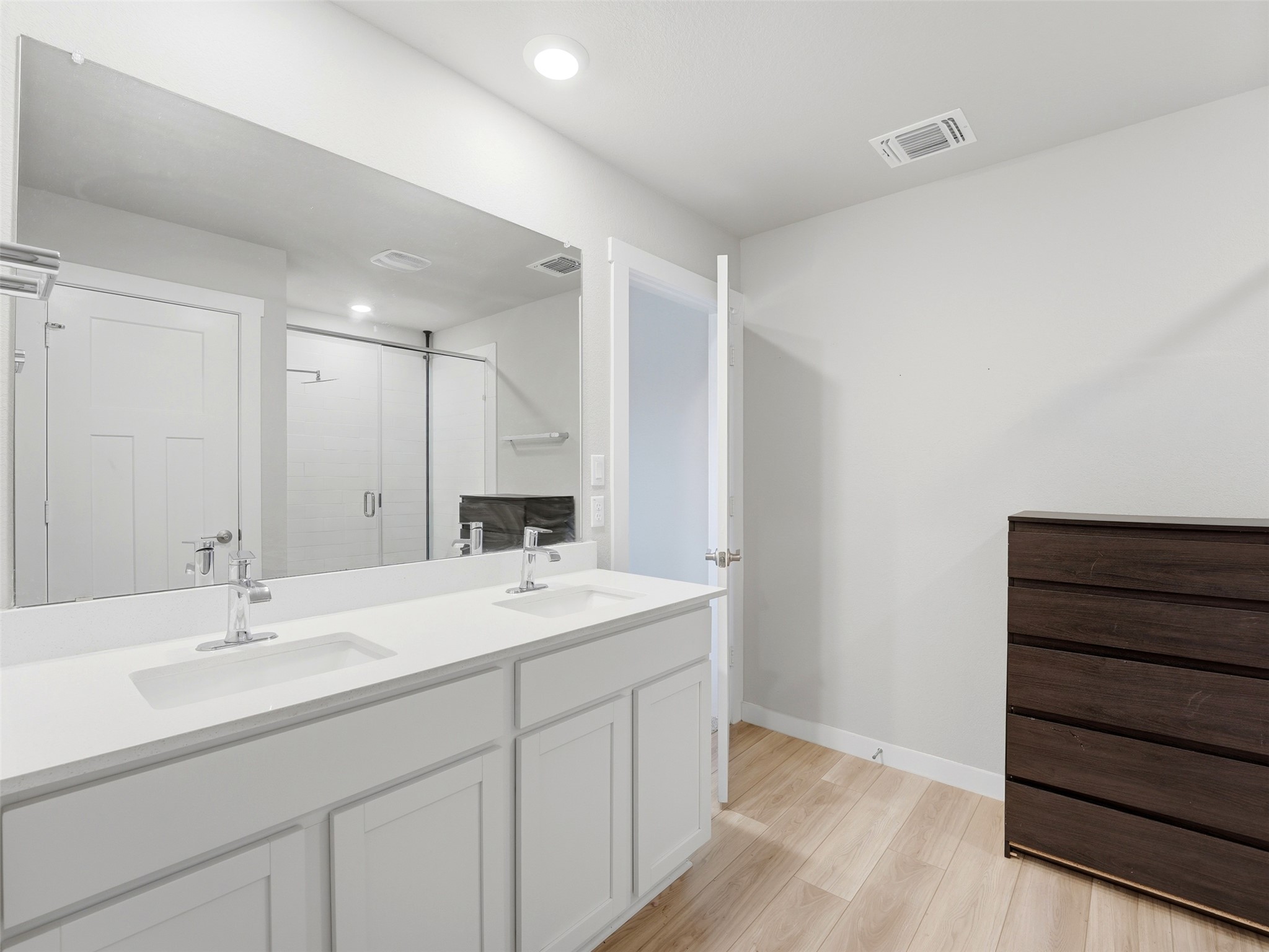 1024 Tipton Street Georgetown, TX 78633 - Photo 16 of 32 Double vanity sinks and a spacious mirror complete this modern bathroom.