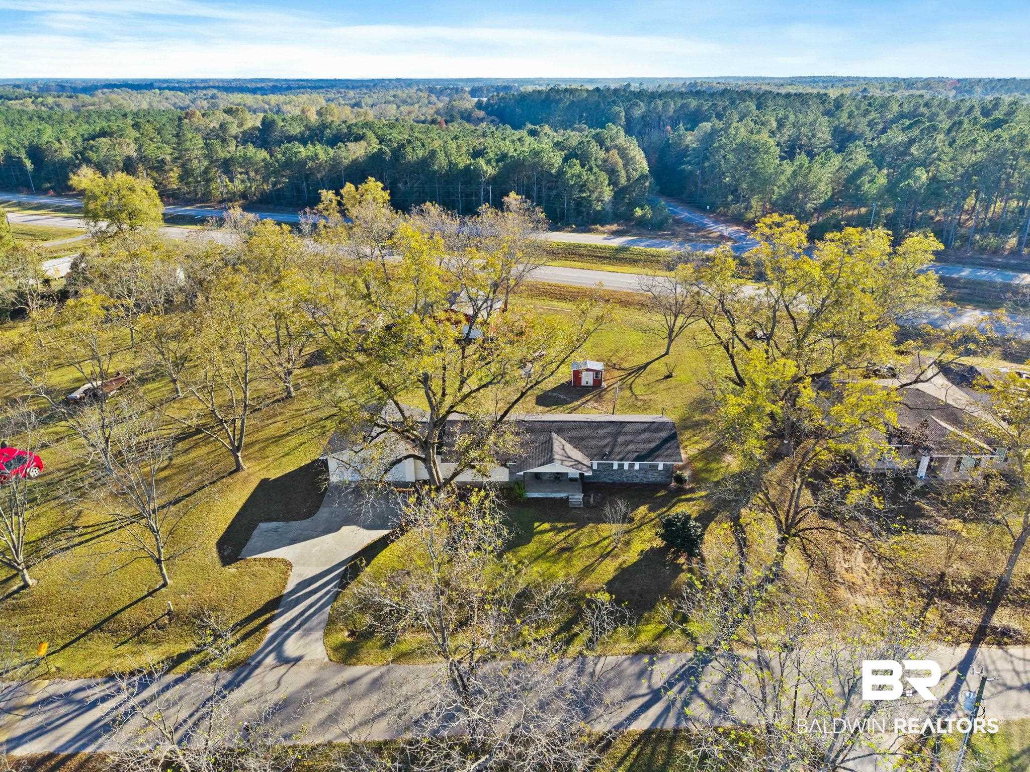 21267 Loop Road Andalusia, AL 36421 - Photo 66 of 72 Drone / aerial view of a heavily wooded area