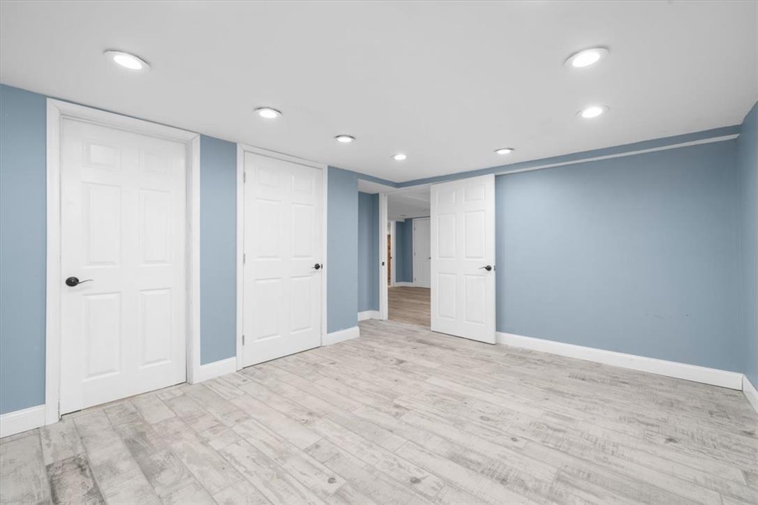 988 Hoch Road Danielsville, PA 18038 - Photo 19 of 29 Recessed lighting illuminates this versatile space, featuring durable wood flooring and clean white trim.