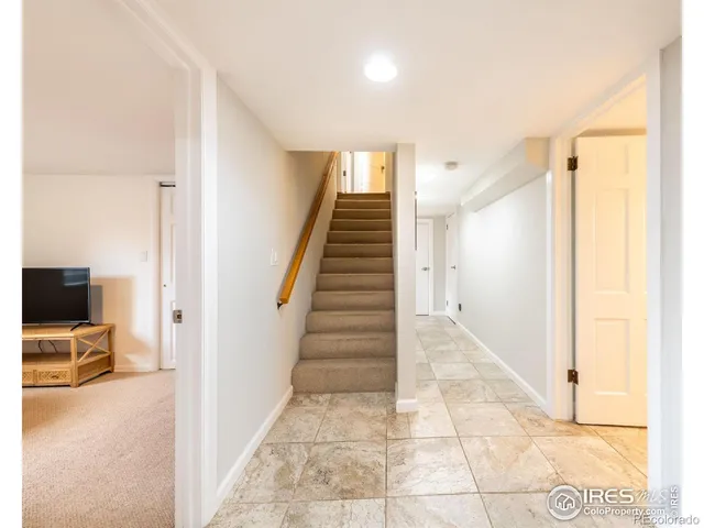 a view of a hallway with seating area