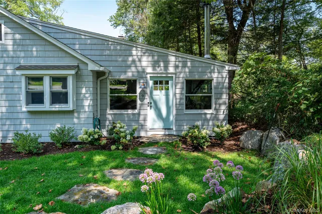 a view of a house with garden and plants