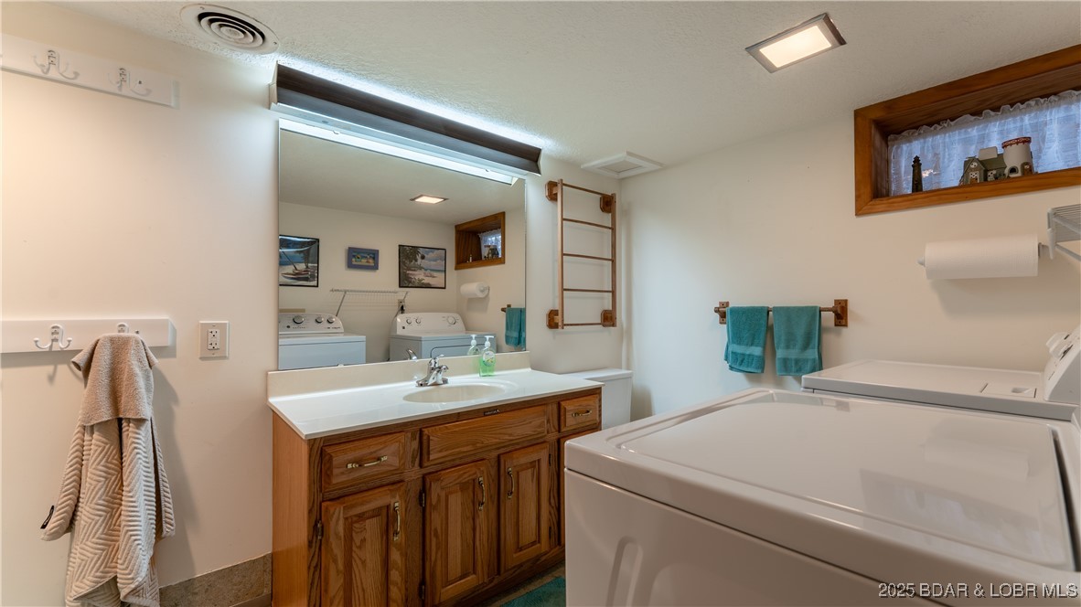 1318 Susan Road Lake Ozark, MO 65049 - Photo 18 of 29 Lower Level Bathroom and Laundry
