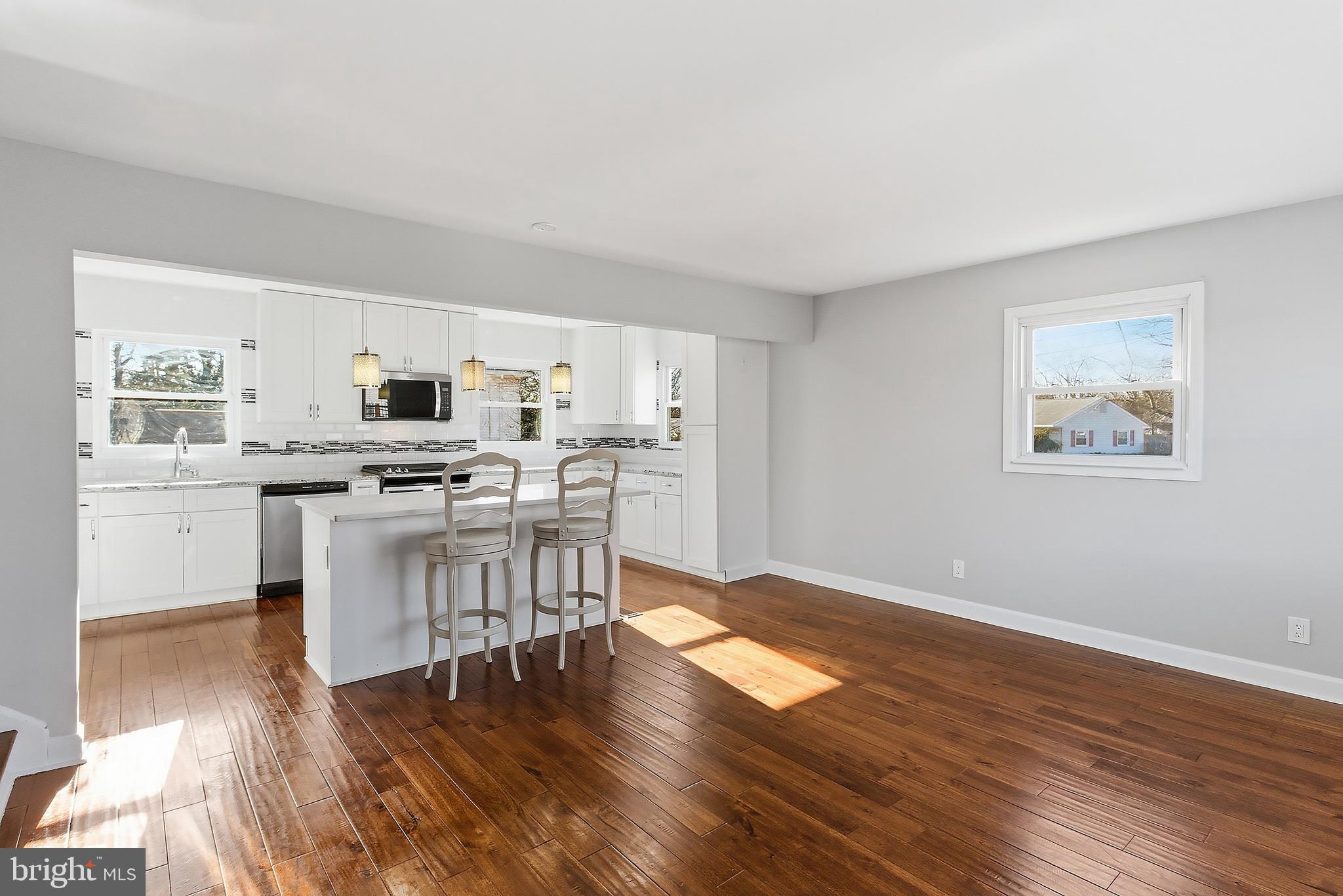 183 Jordan Road Somers Point, NJ 08244 - Photo 11 of 40 a kitchen with stainless steel appliances a refrigerator and a stove top oven