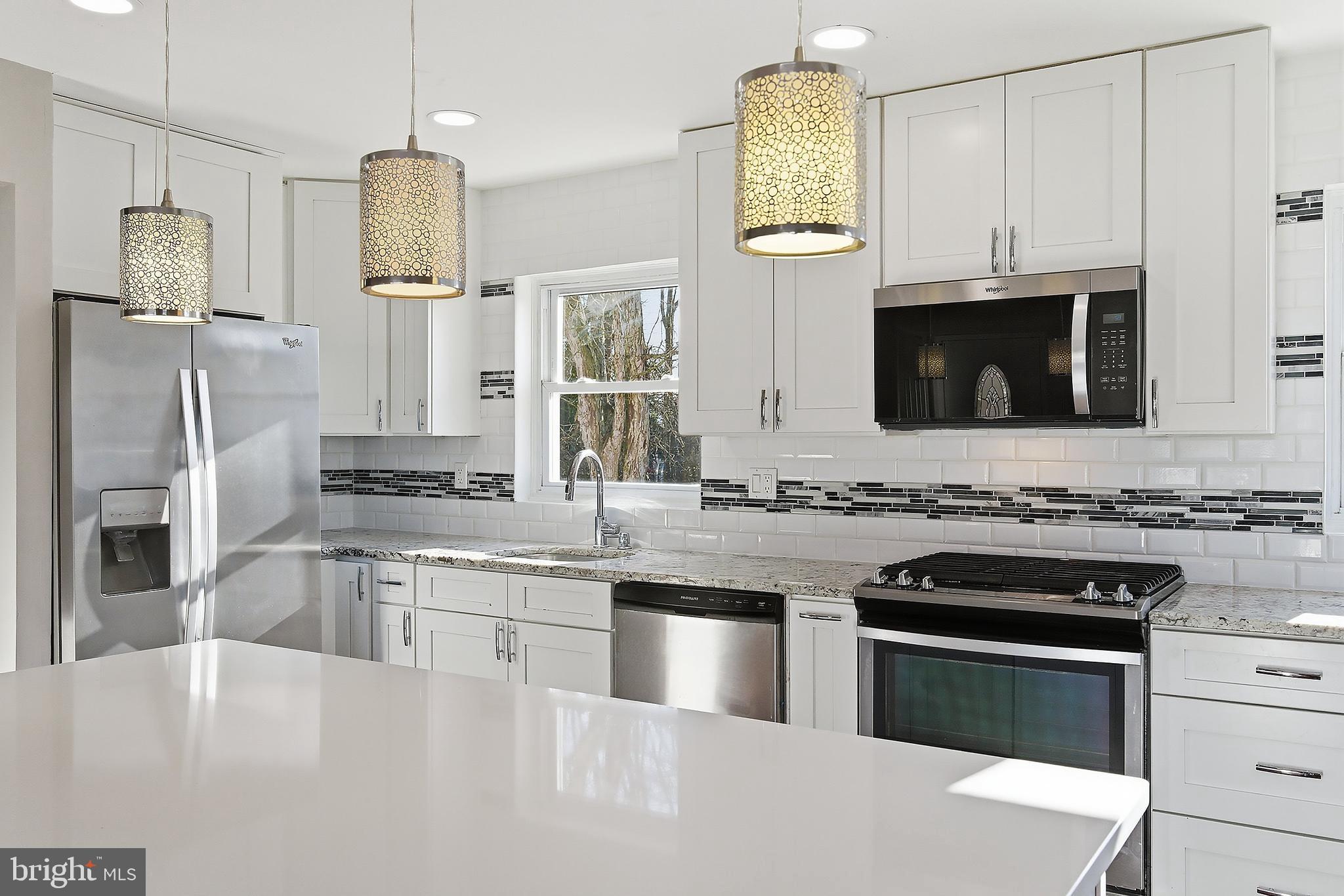 183 Jordan Road Somers Point, NJ 08244 - Photo 16 of 40 a kitchen with stainless steel appliances a stove sink microwave and refrigerator