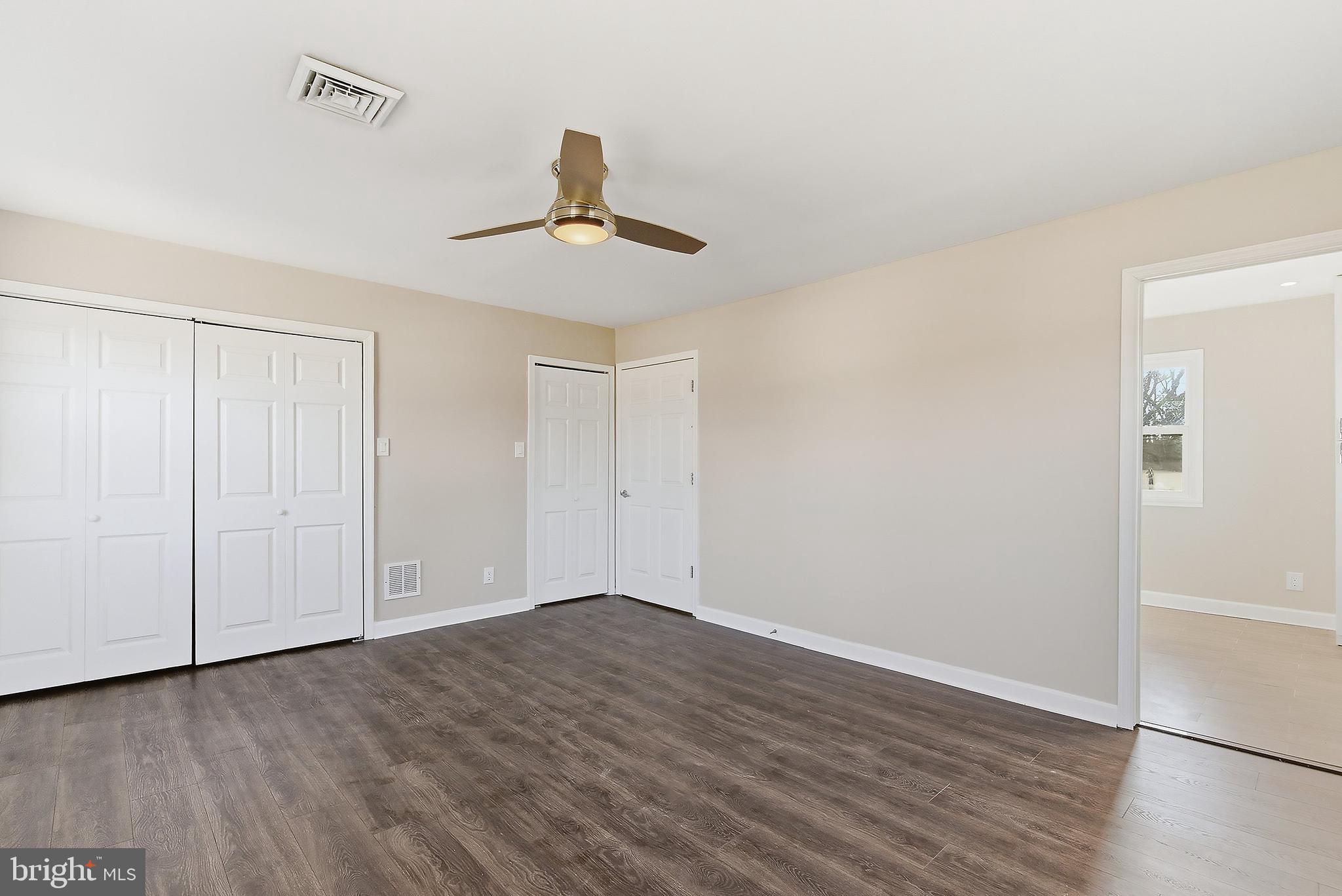 183 Jordan Road Somers Point, NJ 08244 - Photo 18 of 40 a view of an empty room with wooden floor and a window