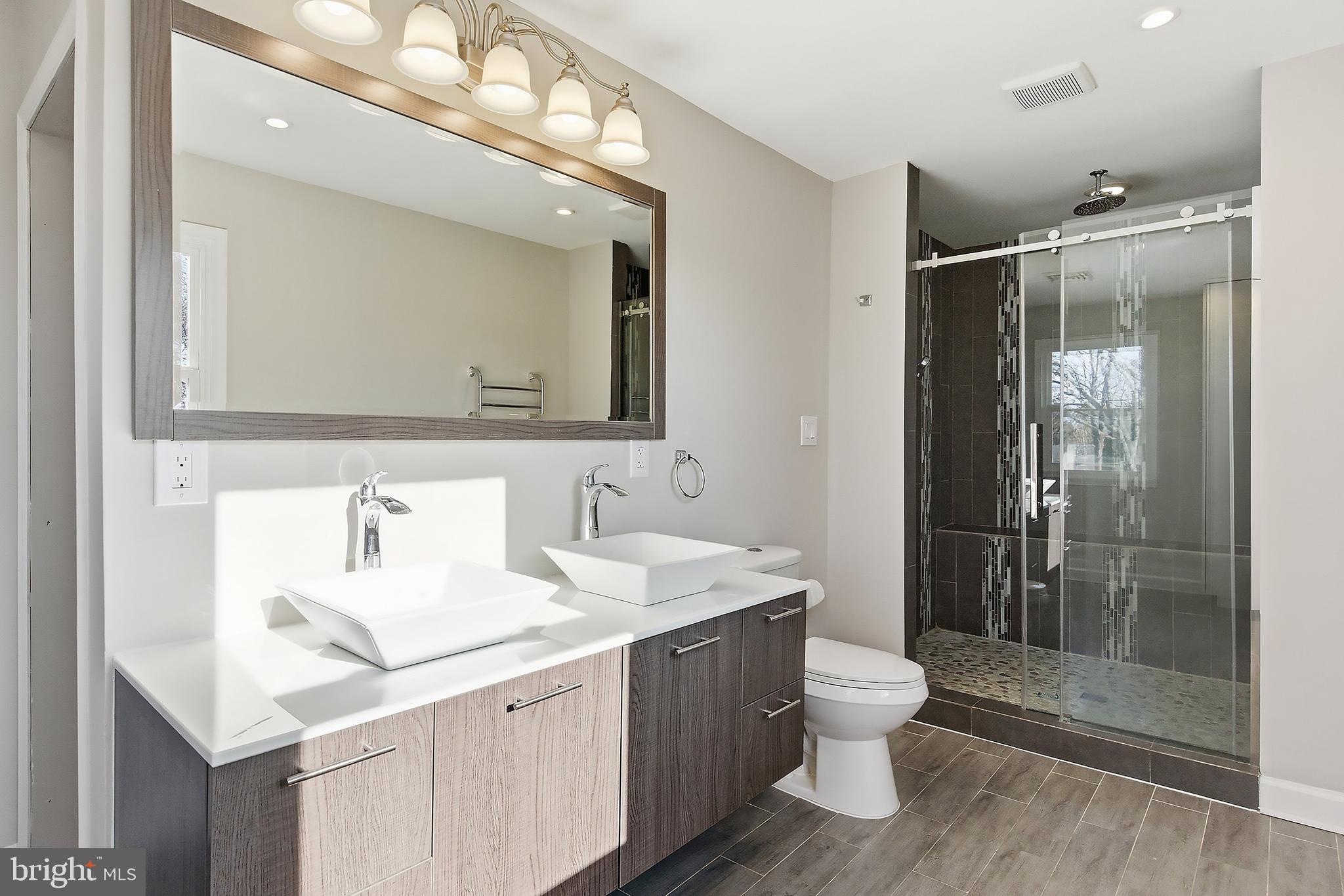 183 Jordan Road Somers Point, NJ 08244 - Photo 25 of 40 a bathroom with a double vanity sink mirror and toilet