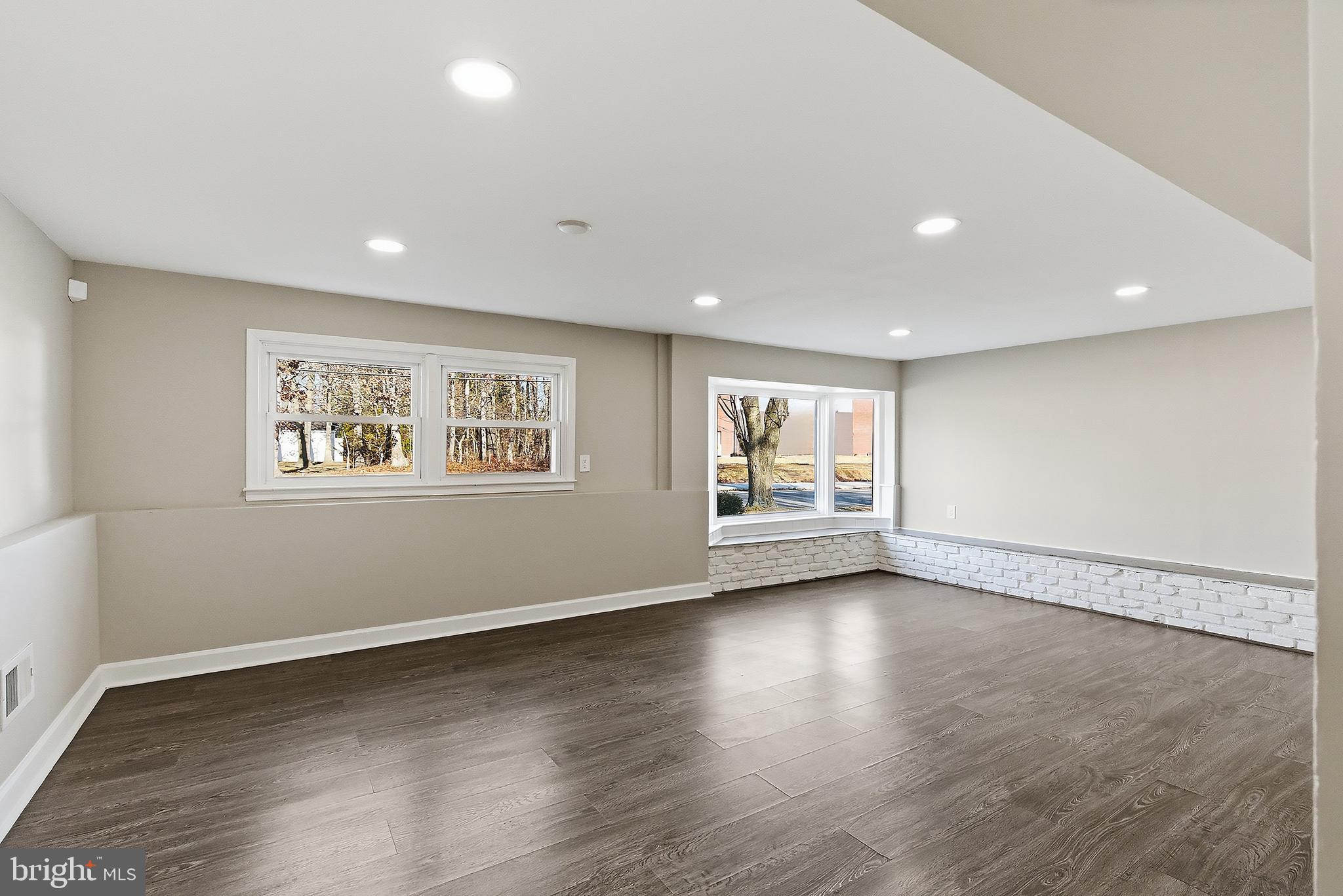 183 Jordan Road Somers Point, NJ 08244 - Photo 33 of 40 a view of an empty room with a window and wooden floor