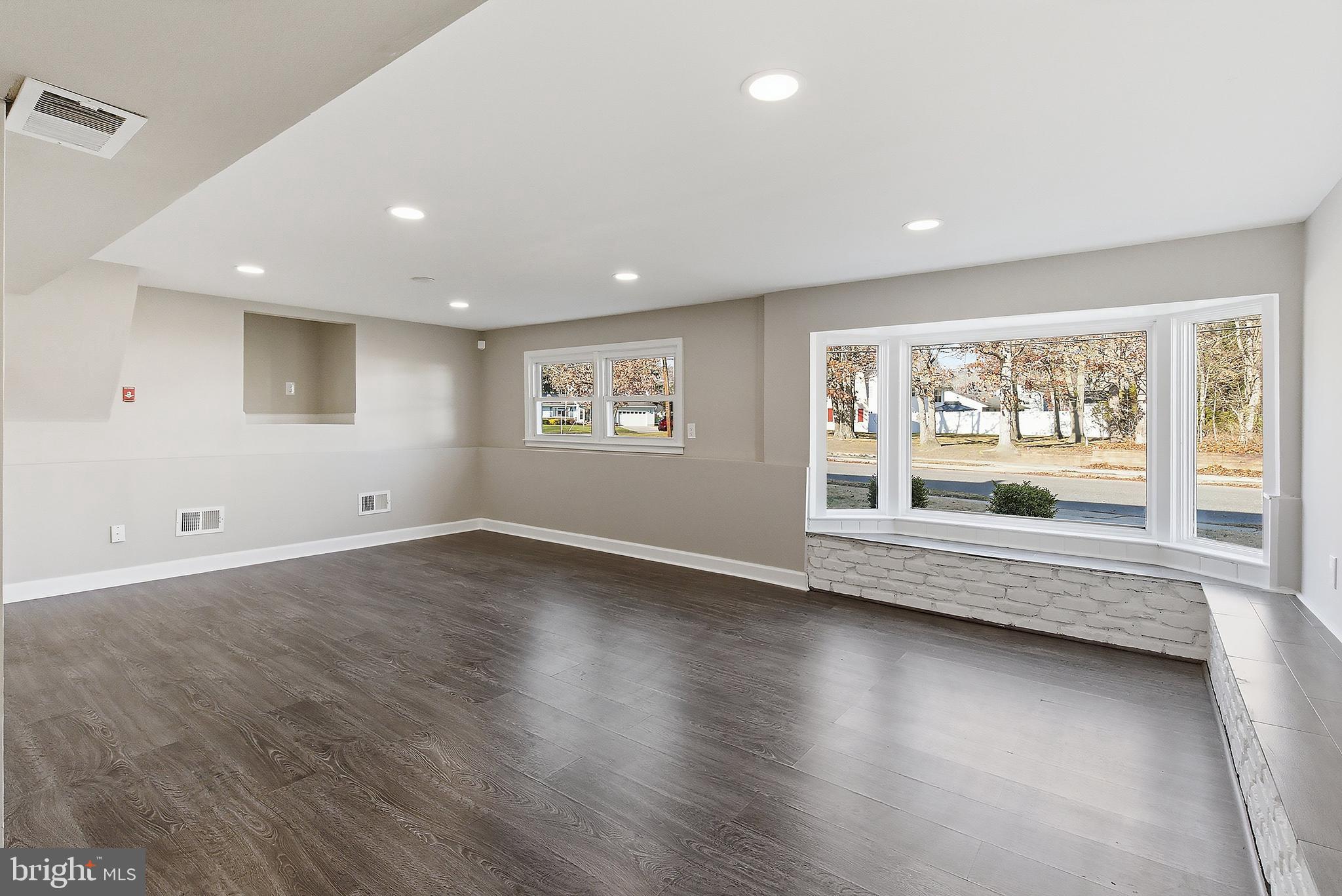 183 Jordan Road Somers Point, NJ 08244 - Photo 34 of 40 a view of an empty room with wooden floor and a window