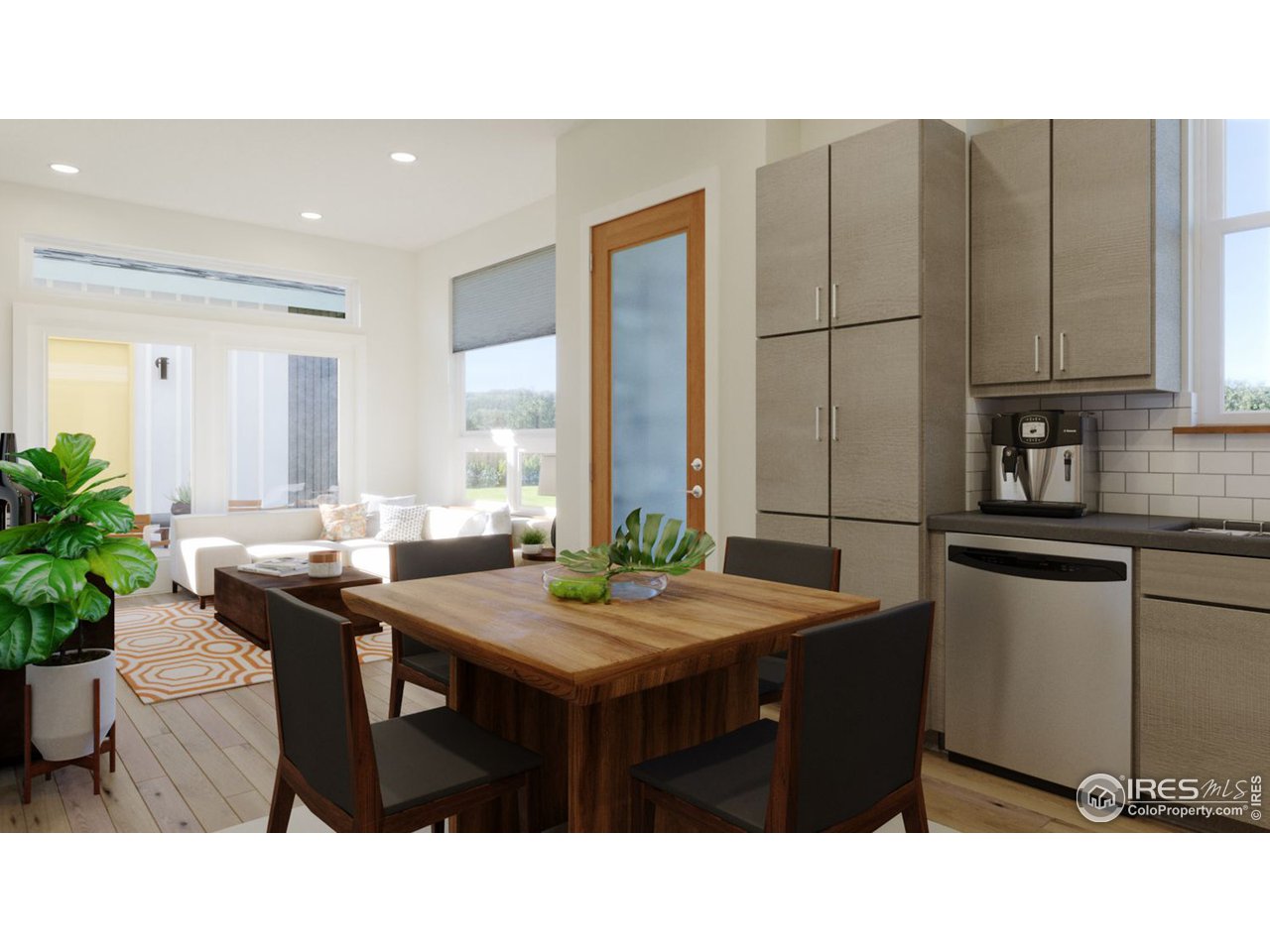 864 Cimarron Drive, Unit B Lafayette, CO 80026 - Photo 3 of 5 a kitchen with a table a sink and cabinets