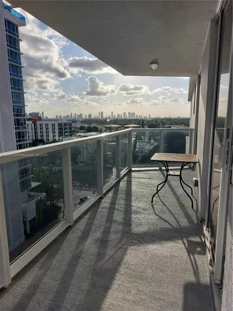 a view of hallway with wooden floor