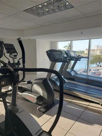 a view of a swimming pool with chairs and a table