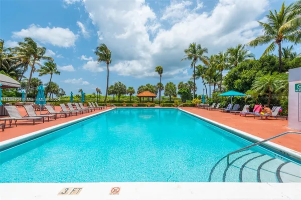 a view of a patio with a table chairs and a backyard