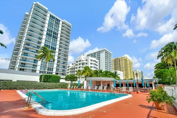 an outdoor space with patio and swimming pool