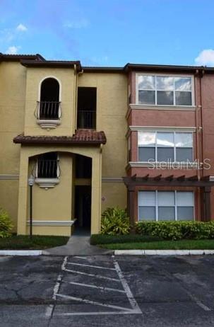 5156 Conroy Road, Unit 1134 Orlando, FL 32811 - Photo 1 of 1 a front view of a house with plants