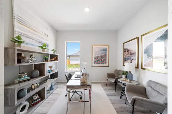 a living room with furniture a rug and a window