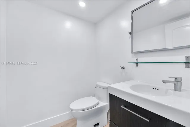 a bathroom with a sink and toilet