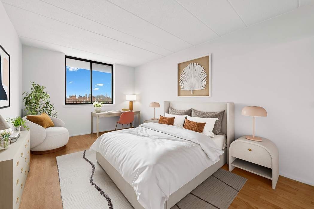 23-22 30th Road, Unit 10H Queens, NY 11102 - Photo 4 of 16 a bedroom with bed and window